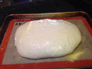 The dough round is rising for a second time for 3 hours.